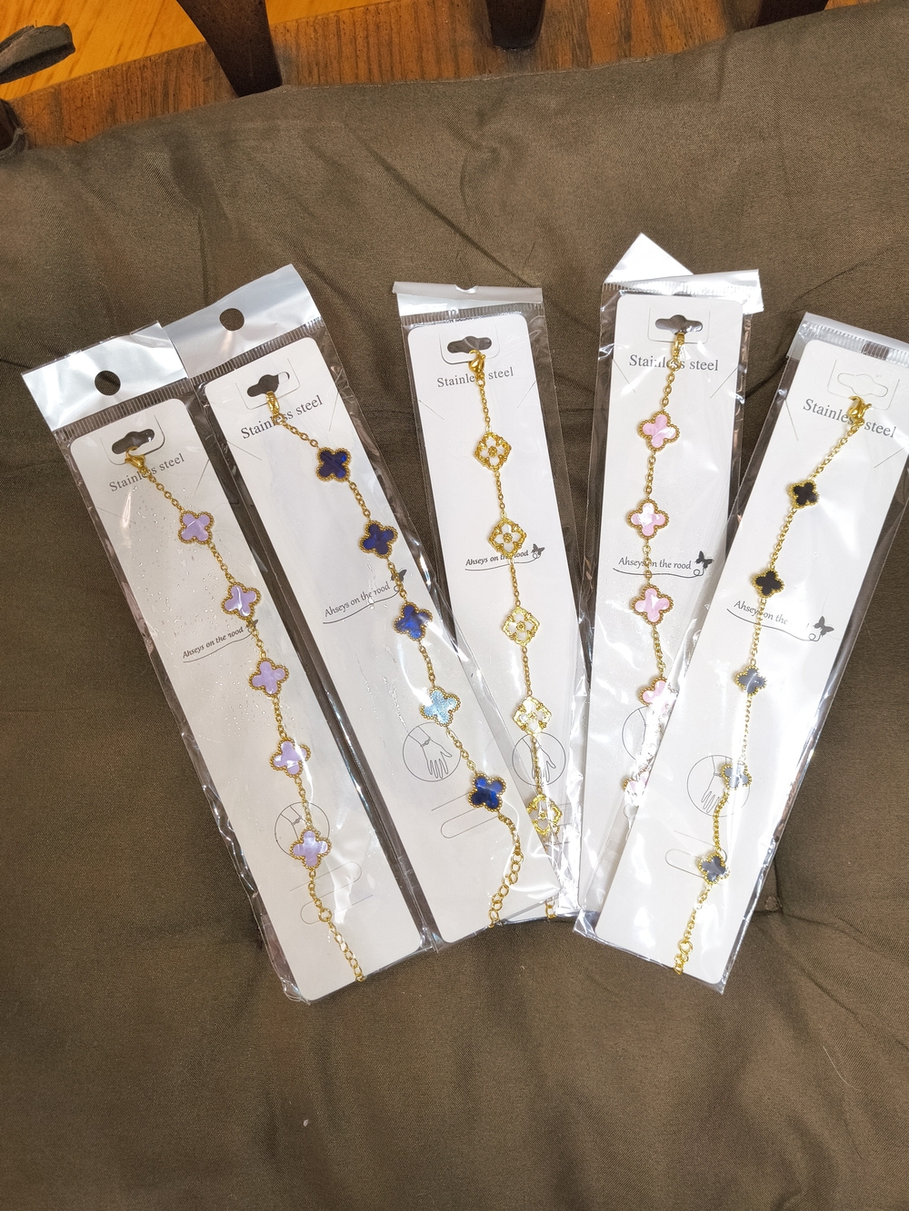 Gold Stainless Steel Clover Link Bracelet with Pink, Blue And Black Accents